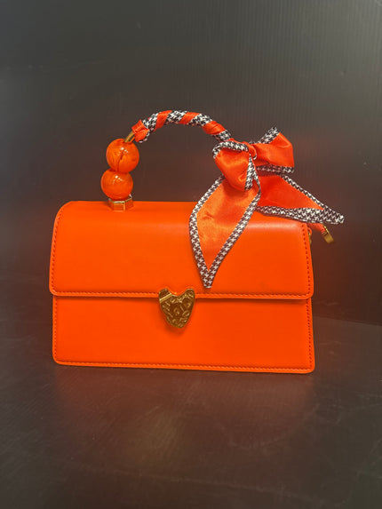 Orange Vegan clutch with pear and ribbon handle