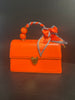 Orange Vegan clutch with pear and ribbon handle