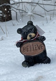 Resin Black Bear holding message sign