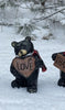 Resin Black Bear holding message sign