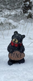 Resin Black Bear holding message sign