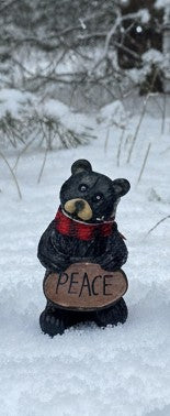 Resin Black Bear holding message sign