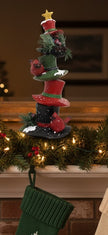 Cardinals sitting on a stack of Christmas Hats