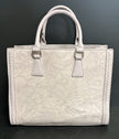 Vegan handbag with embossed floral design